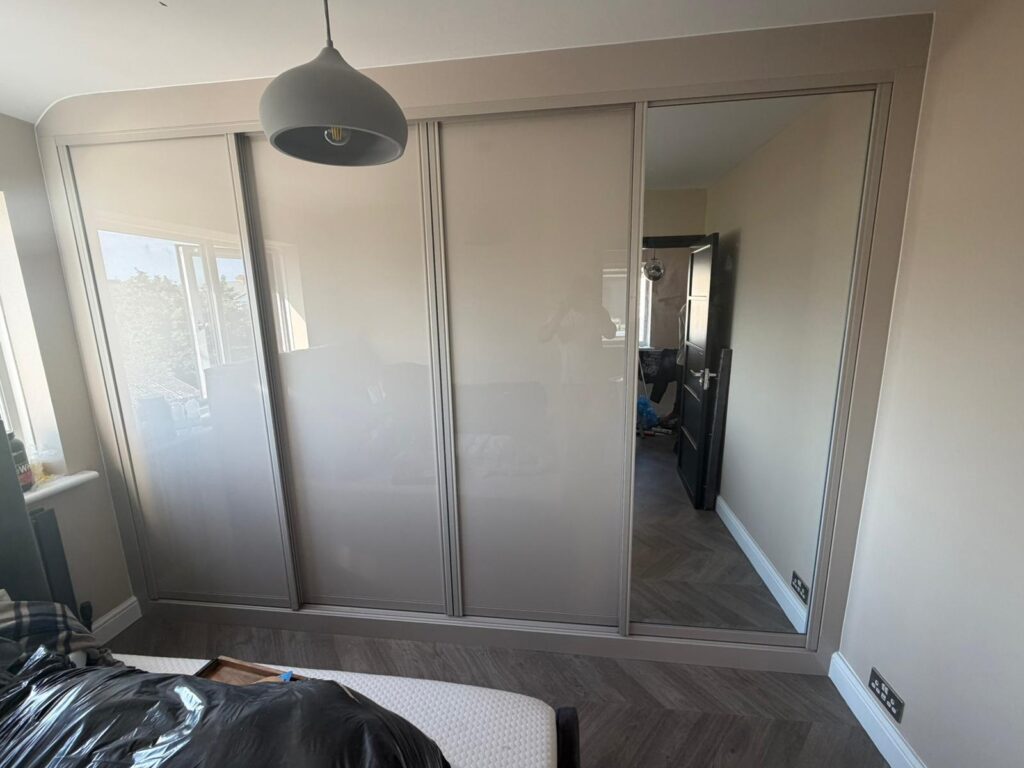 Gloss sliding wardrobe by Python Kitchen