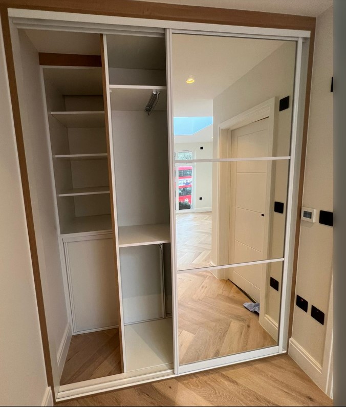 Sliding mirrored wardrobe by Python Kitchen
