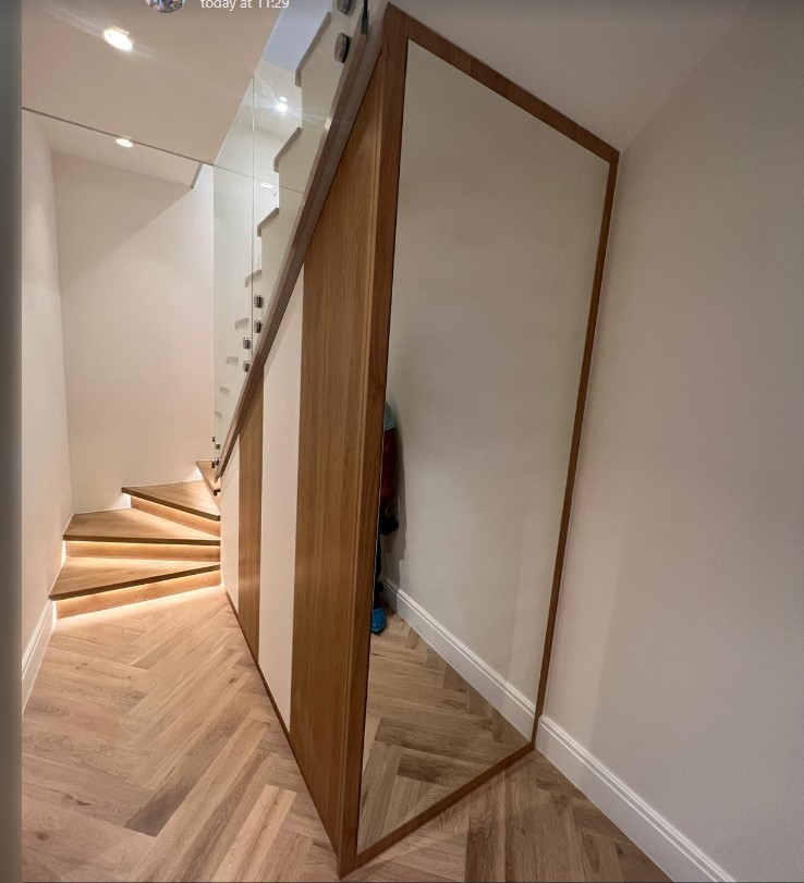 Under-stair wardrobe by Python Kitchen